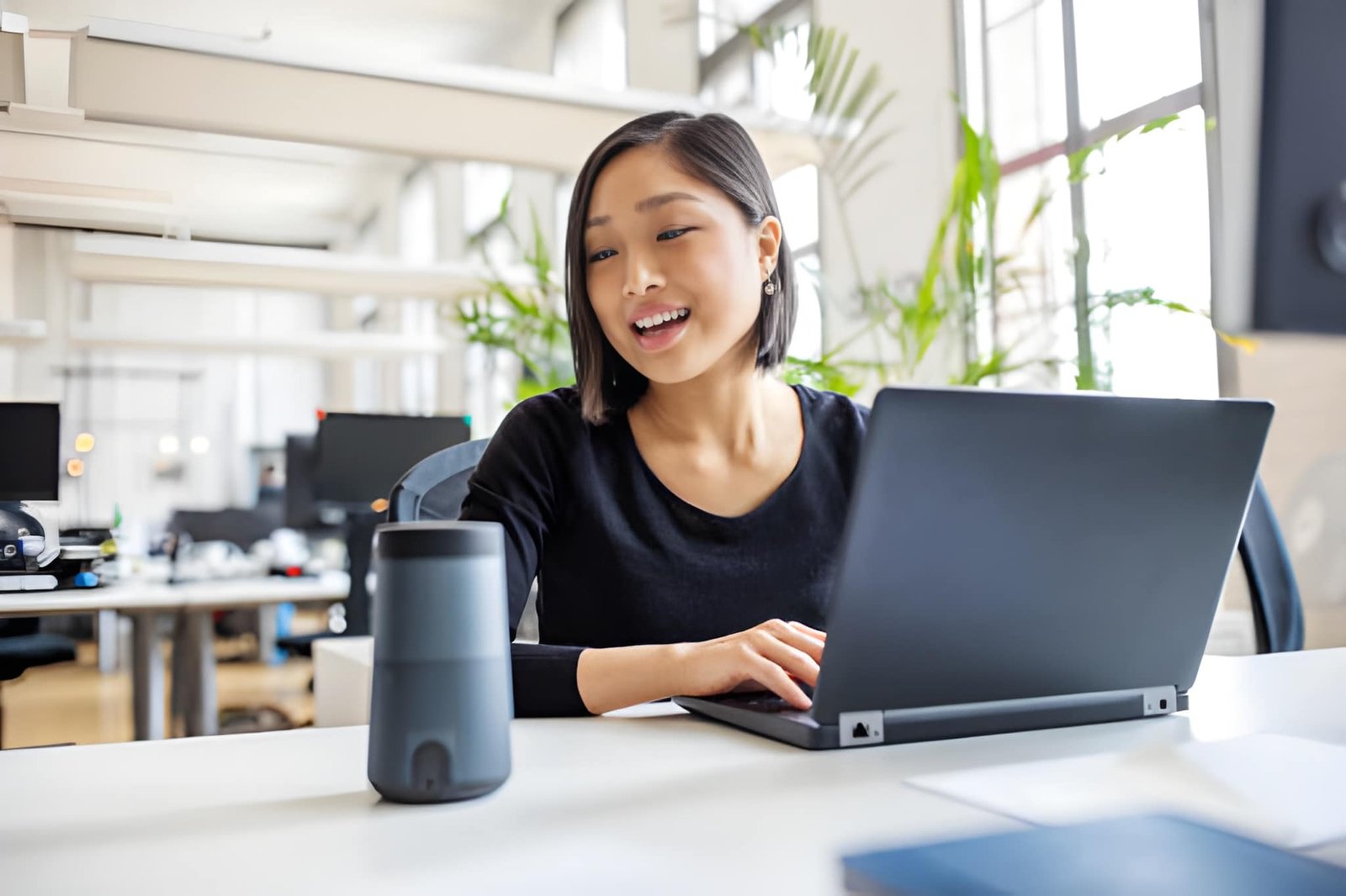 Female consultant reviewing funding plans on a laptop